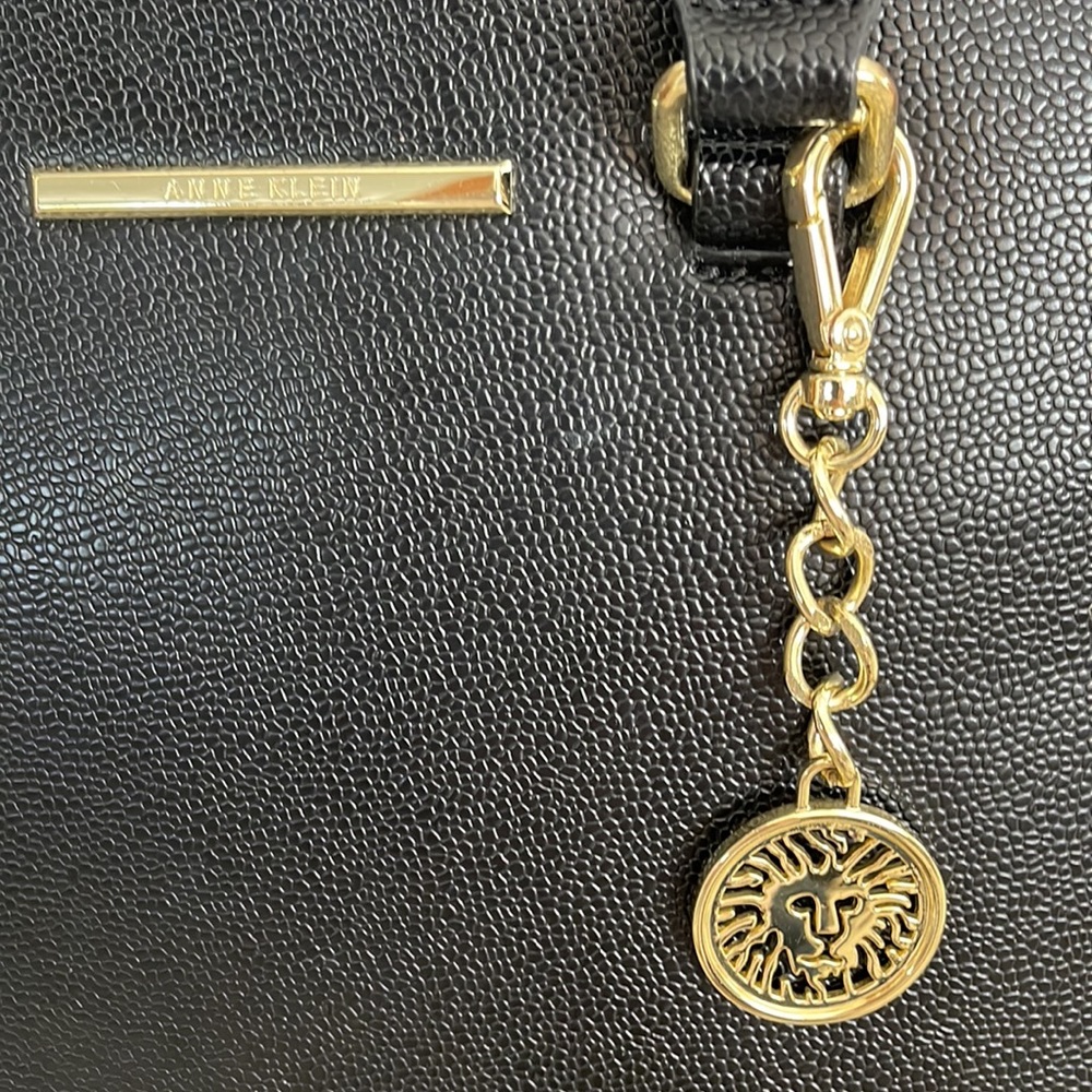 ANN KLEIN Black Pebbled Leather with Logo fob, polkadot interior lining .